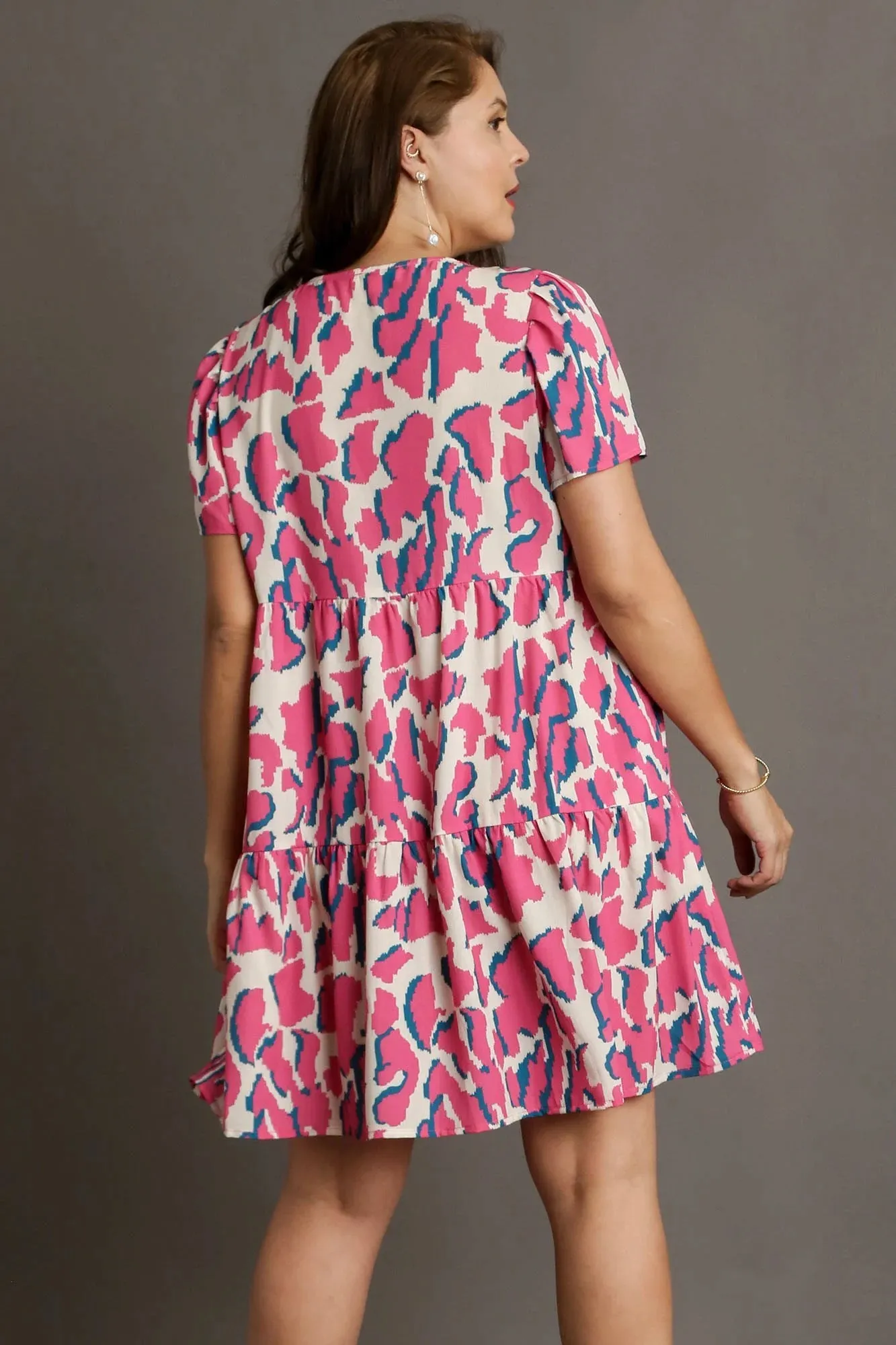 Umgee Full Size Abstract Print Pleat Detail Short Sleeve V-Neck Tiered Dress plus Size