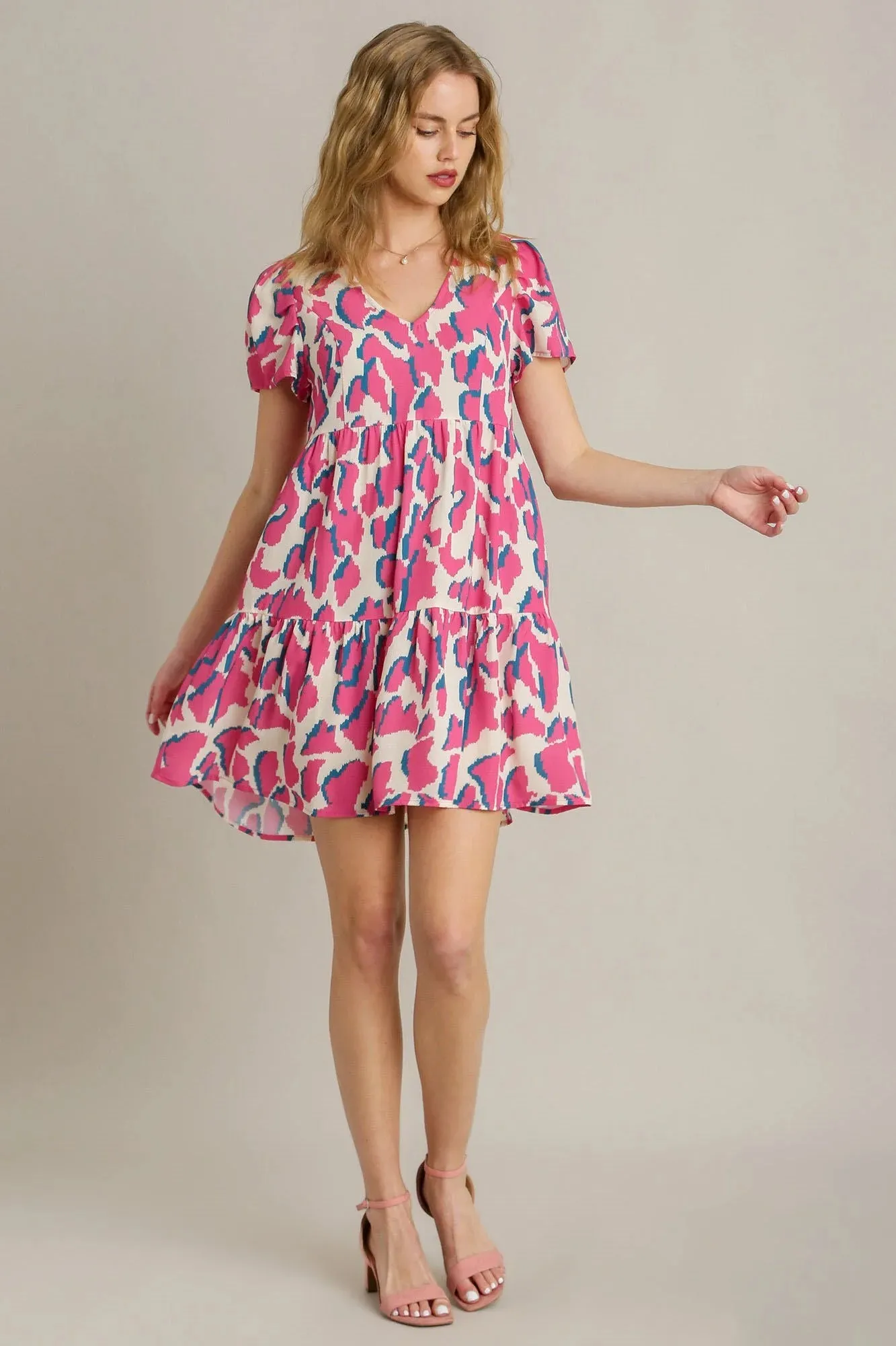 Umgee Full Size Abstract Print Pleat Detail Short Sleeve V-Neck Tiered Dress plus Size